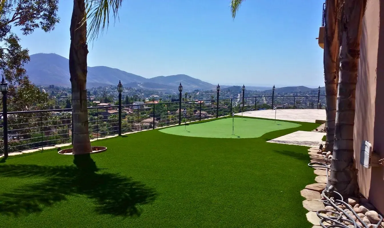 Backyard putting green with curved fringe and landscape borders